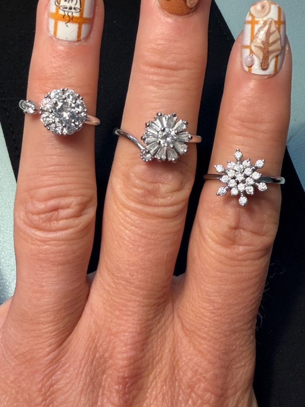 Set of 3 silver adjustable size spinner rings with cluster simulated diamonds